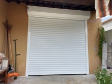 Poseur de volet de garage roulant motorisé SOMFY par professionnel à Gardanne